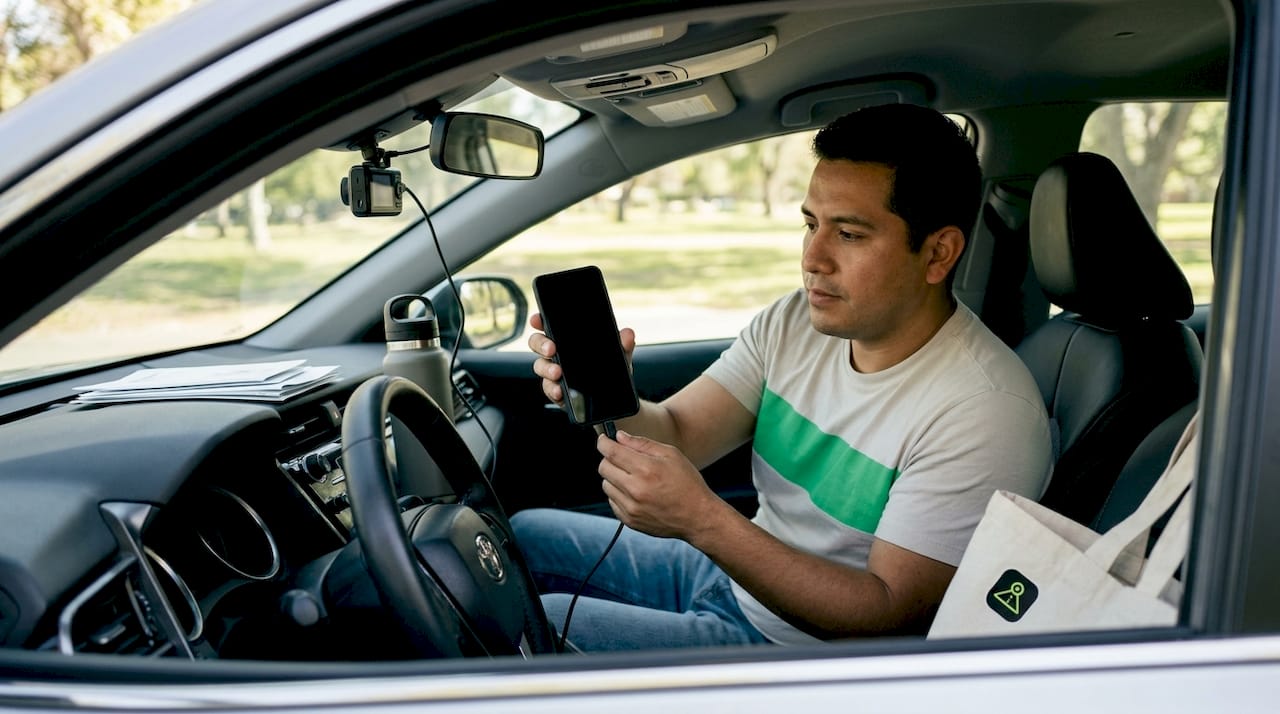Driver syncing dashcam footage on phone