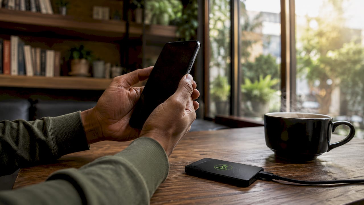 Hands holding smartphone showing storage management tools