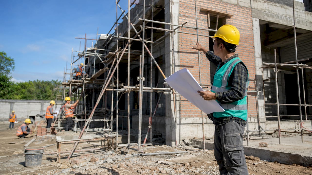 Supervisor inspecting construction quality
