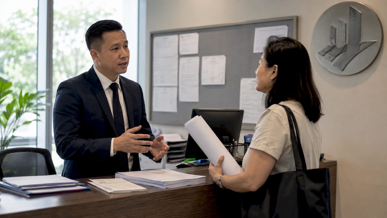 Why Construction Permits Are Required in Singapore BCA officer assisting client with permits