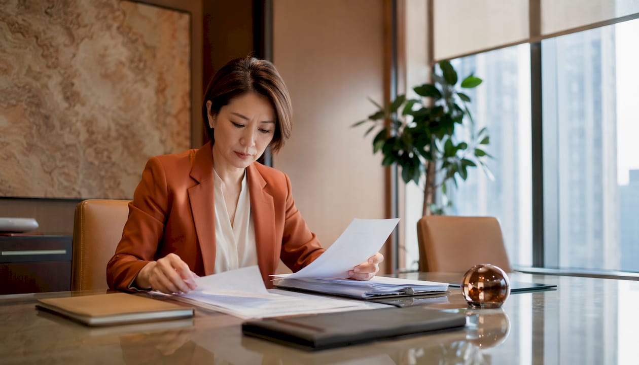 Hands organizing legal property documents