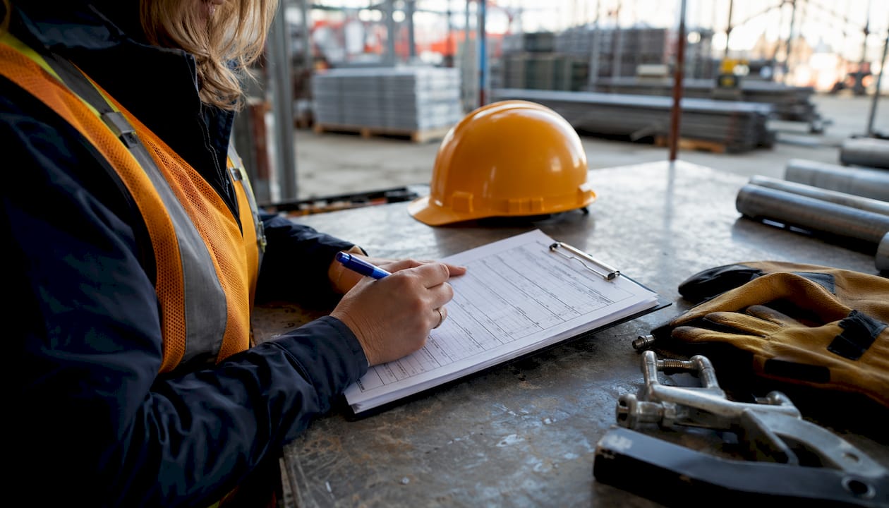 Supervisor marking scaffolding inspection checklist