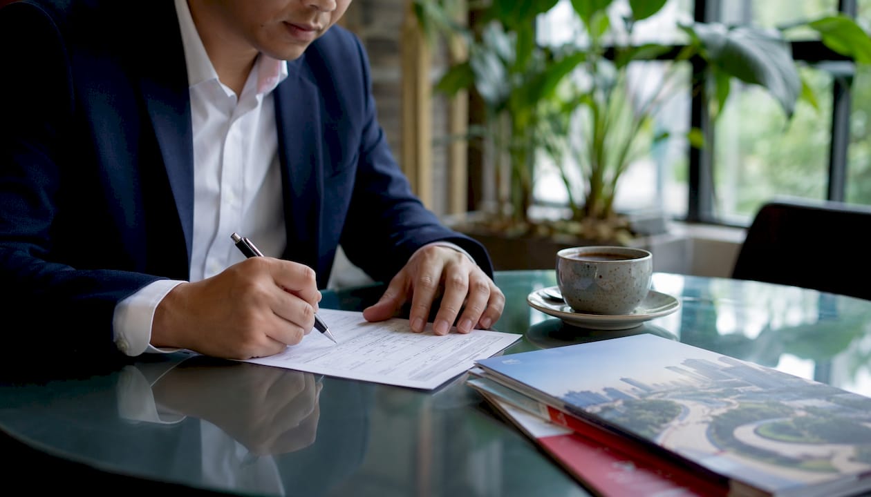Key Steps for LTA Approval in Singapore: 2026 Guide Hands completing street permit application form