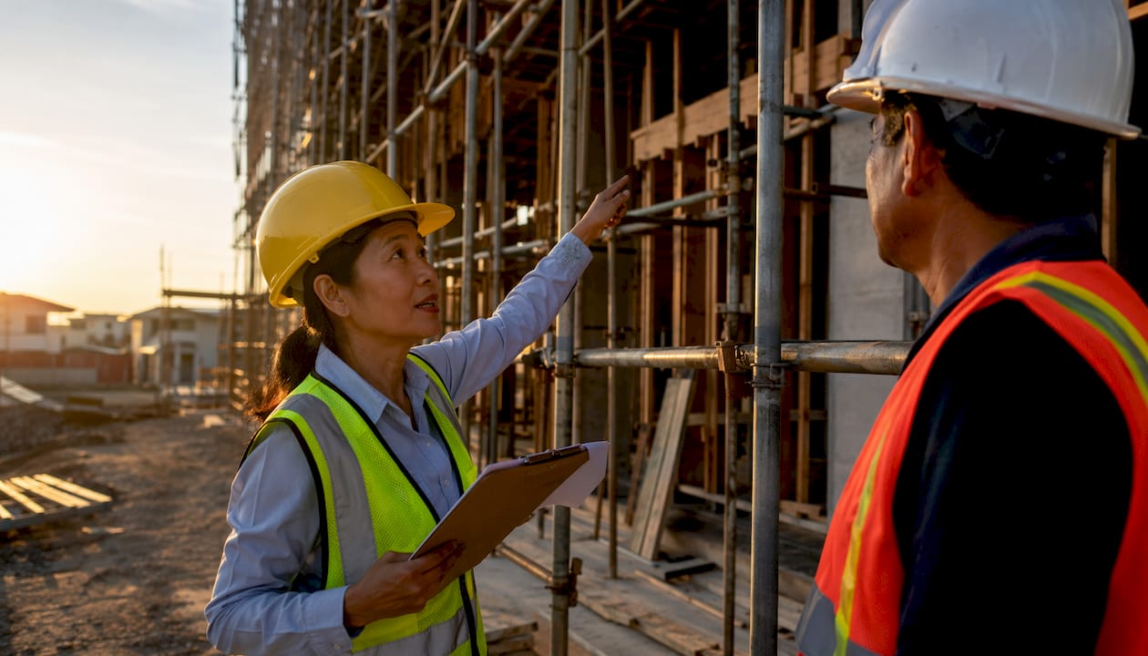 Safety inspector and foreman at construction site