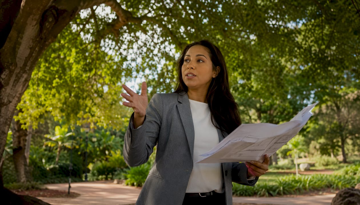 Consultant explaining fire safety plans in meeting