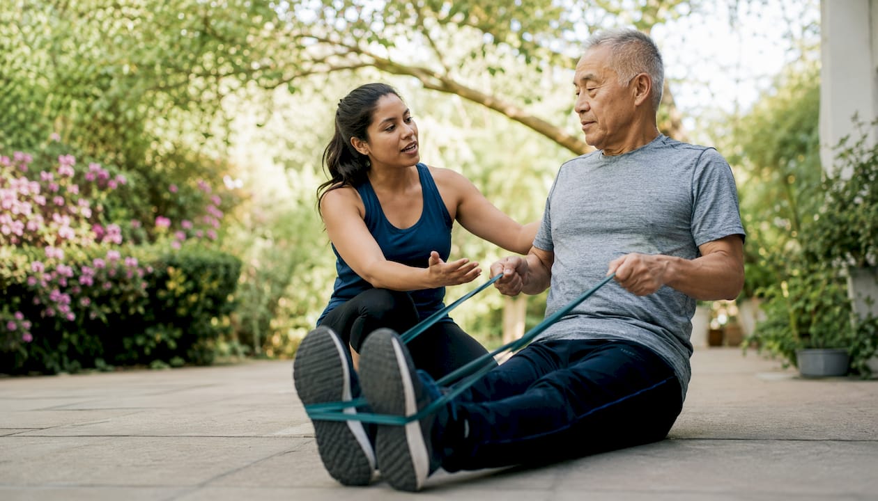 Therapist leading patient corrective exercises