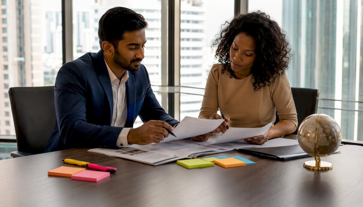 Professionals reviewing commercial lease documents