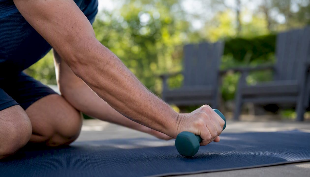 Man doing wrist extension exercise for tennis elbow
