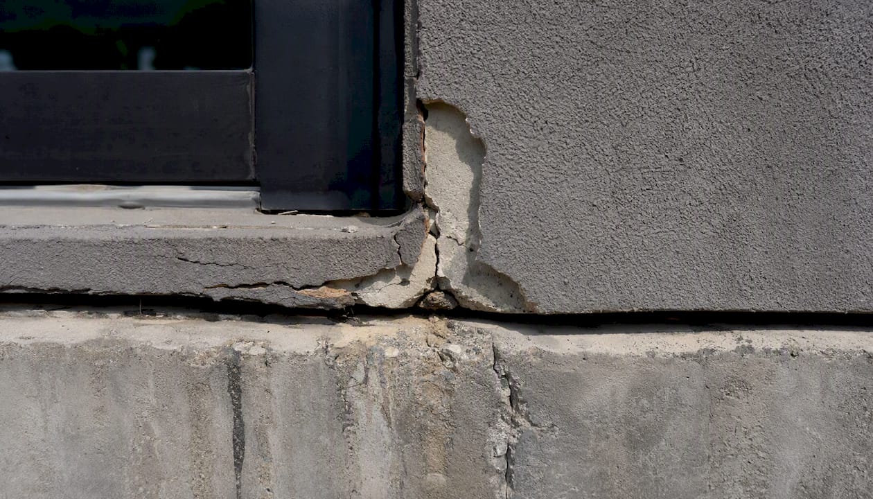 Close-up of damaged facade sections