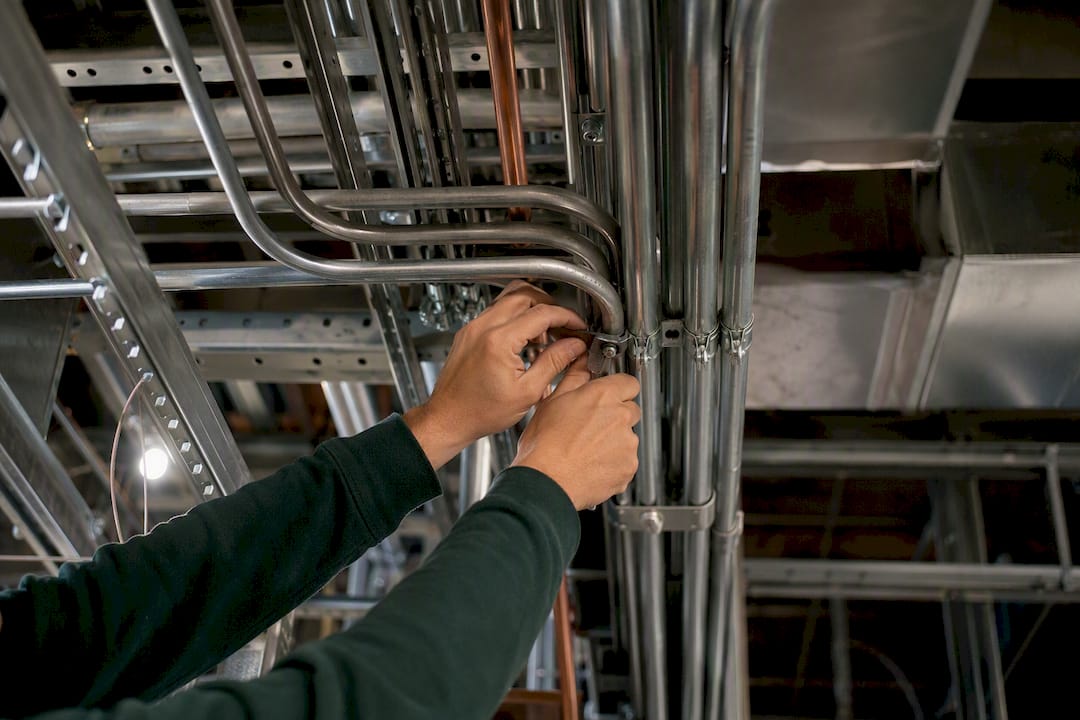 Installer working on congested MEP connections