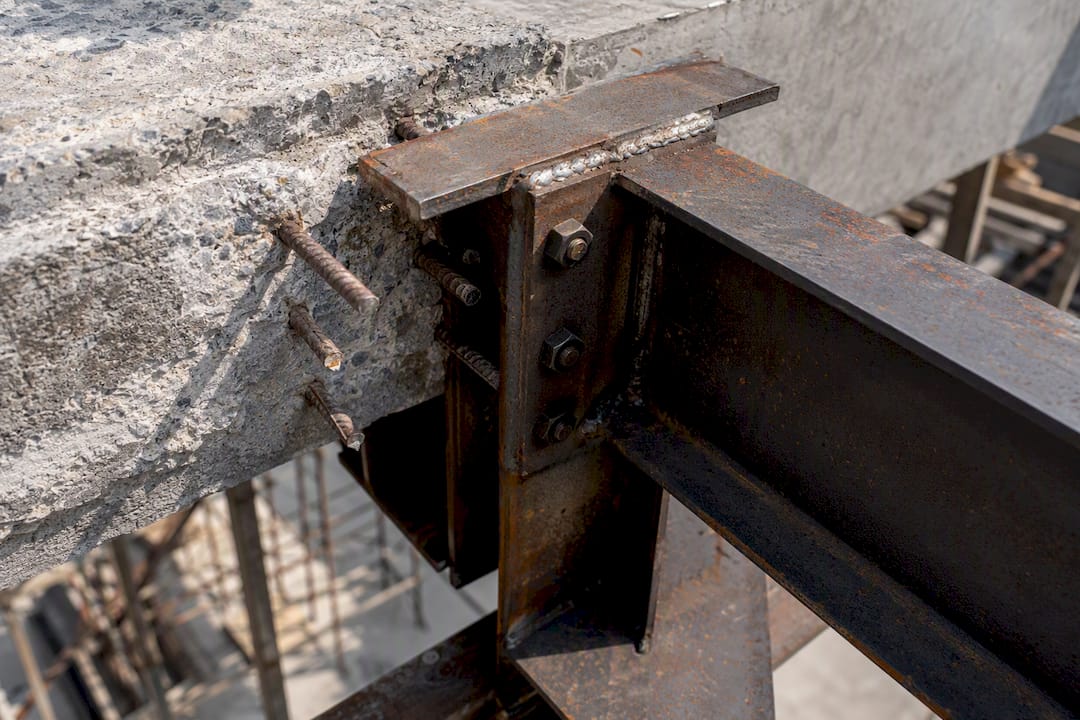 What Belongs on Your Periodic Structural Inspection Checklist Close-up of concrete column and steel beam