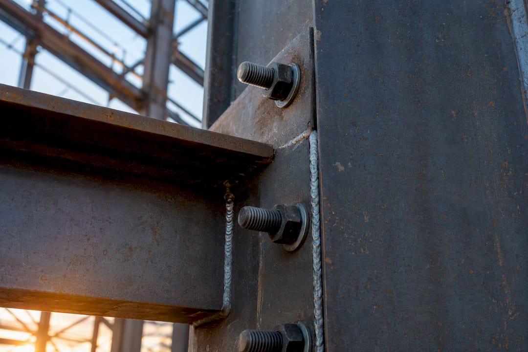 Three Design Strategies Prevent Structural Collapse Steel beam connection detail with bolts and welds