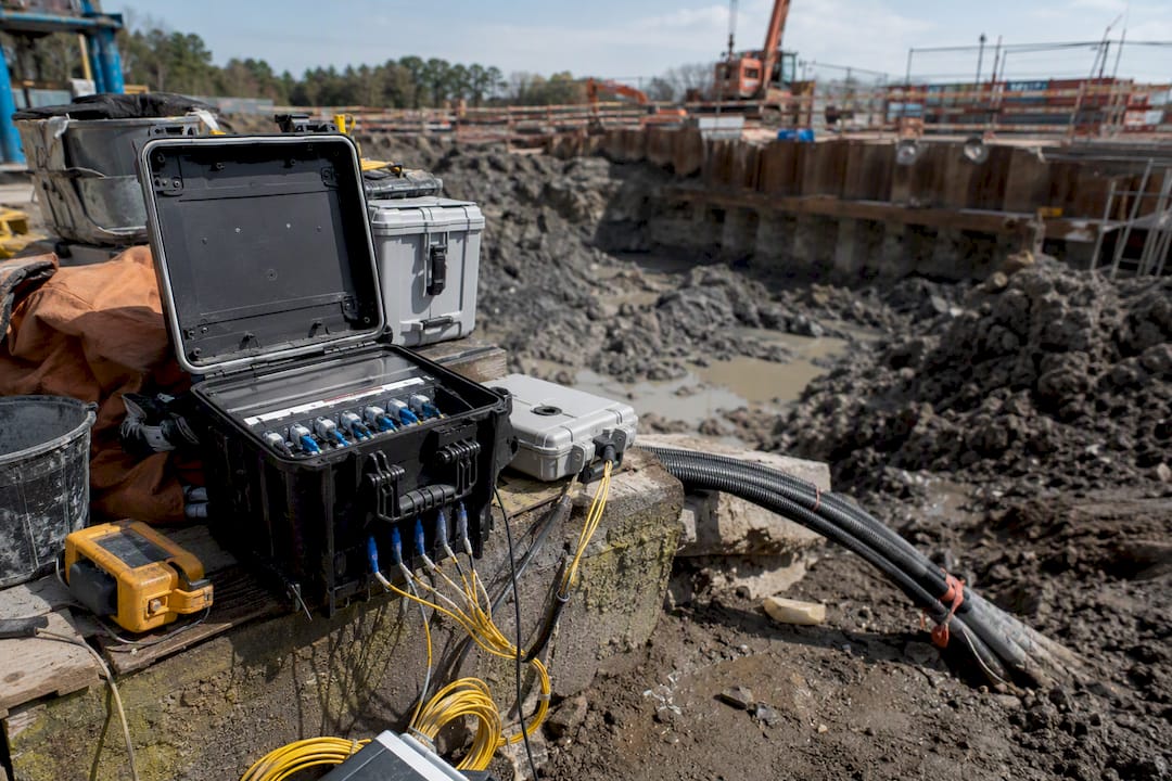Deep Excavation Monitoring: Methods, Sensors, and Data Data logger and fiber optic cables at excavation site