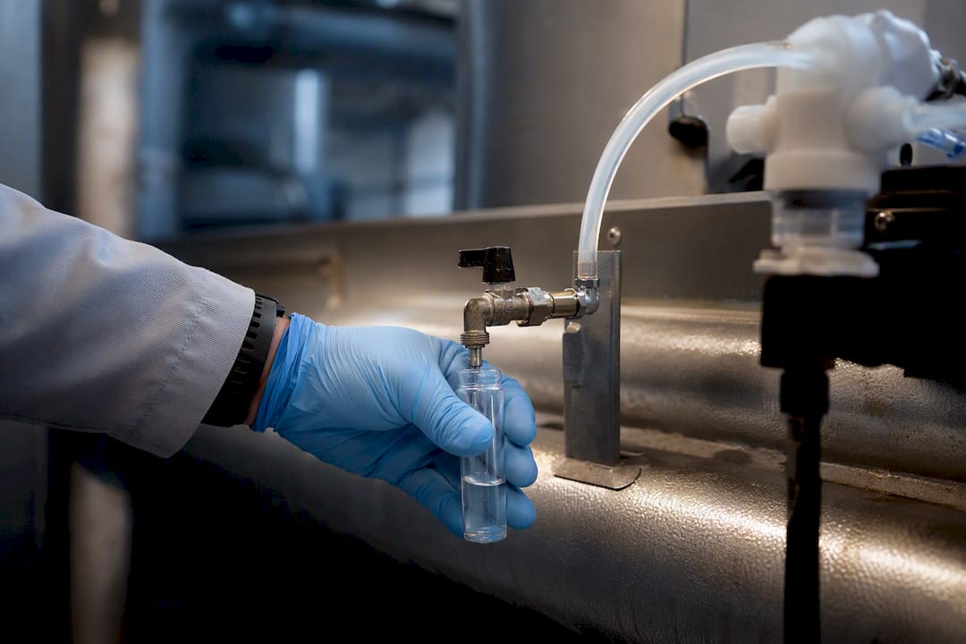 Technician sampling condenser water treatment loop
