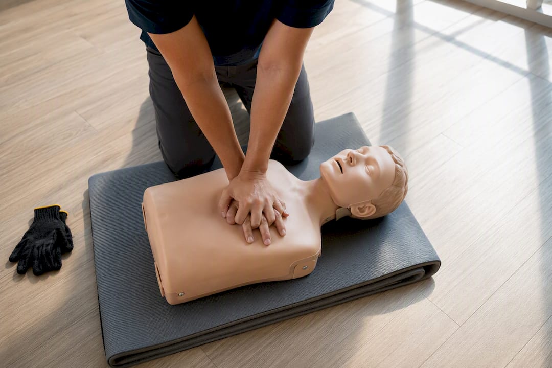 Trainee practising chest compressions