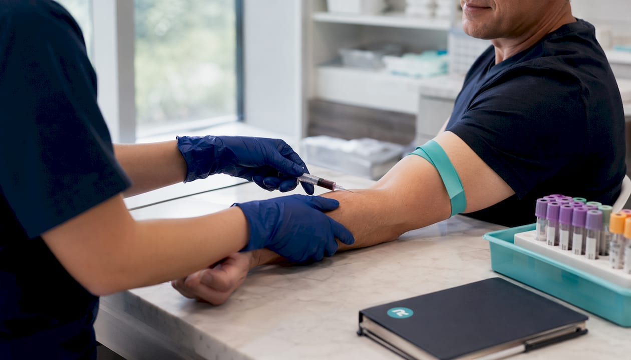 Healthcare professional drawing blood in clinic