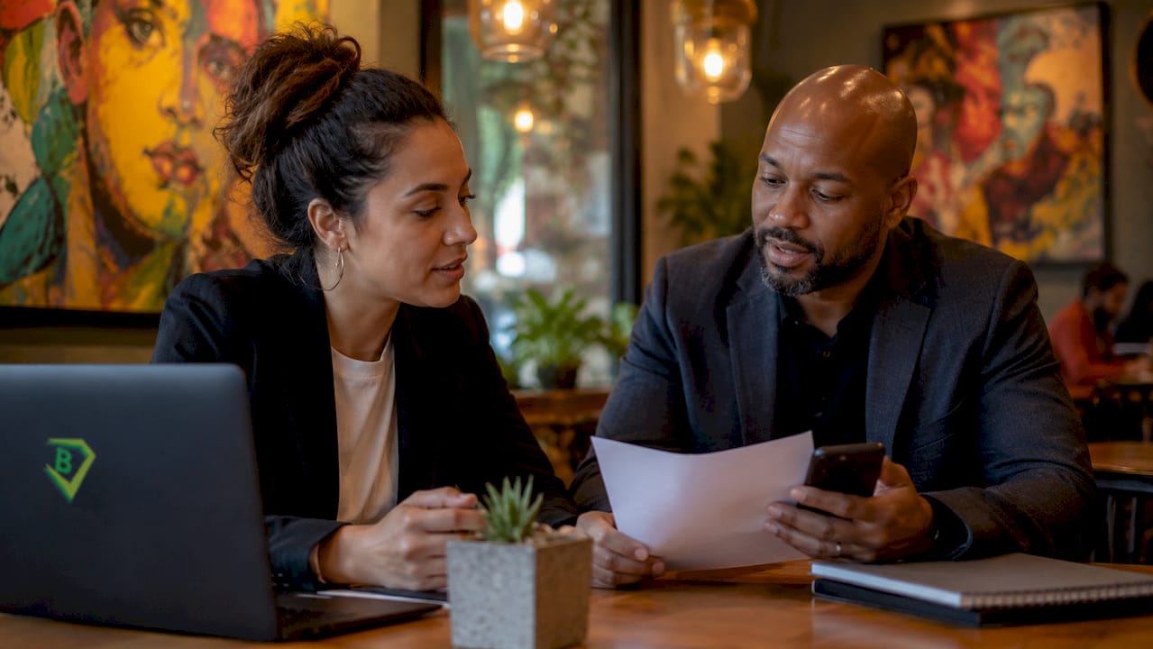 Diverse insurance agents discussing commissions