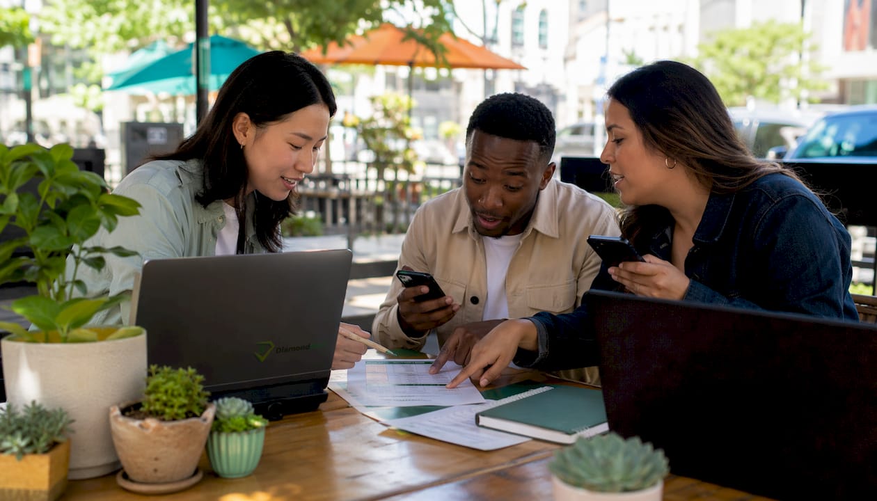 Group collaborating over auto insurance quotes
