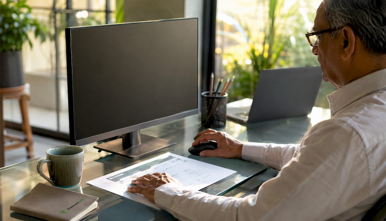 Hands interacting with software document at desk