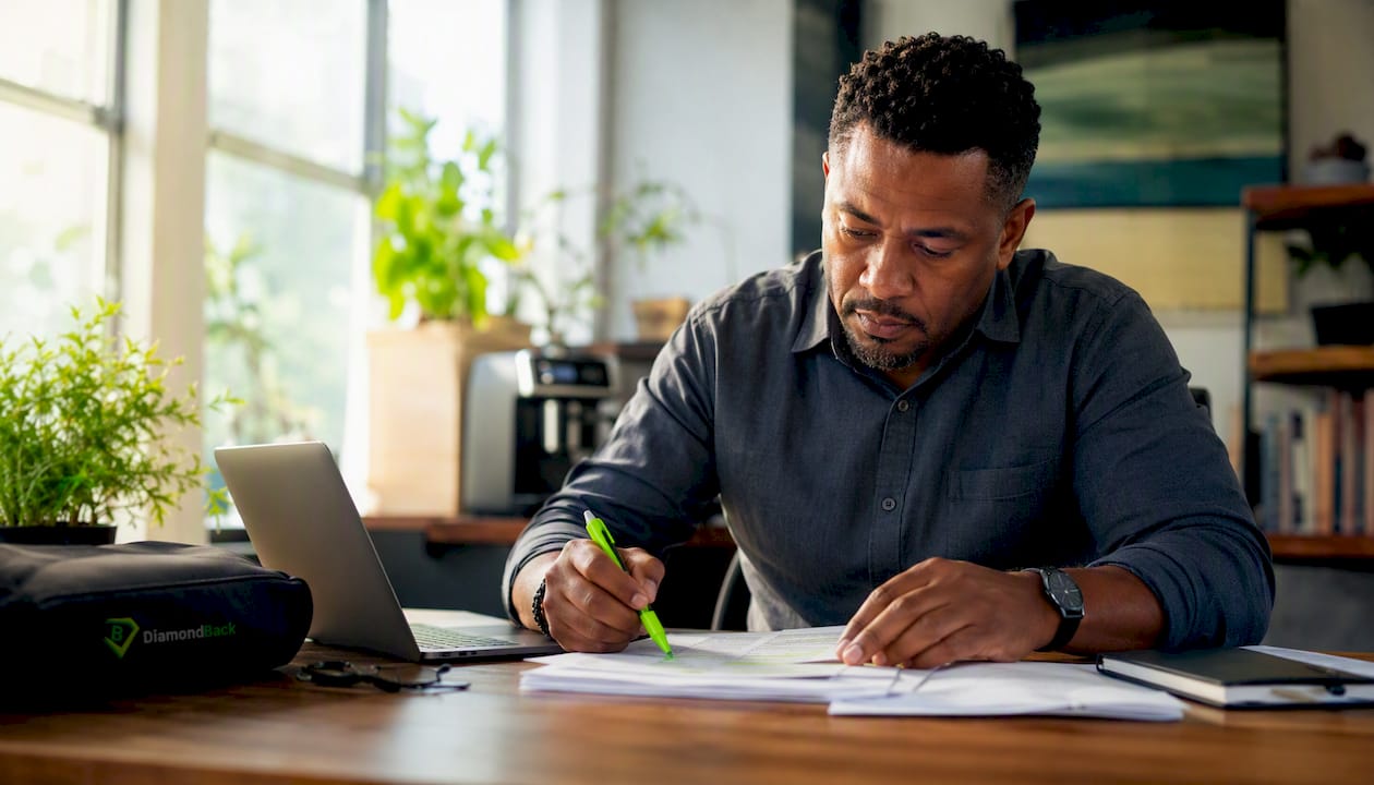 Fleet manager examining trucking insurance paperwork