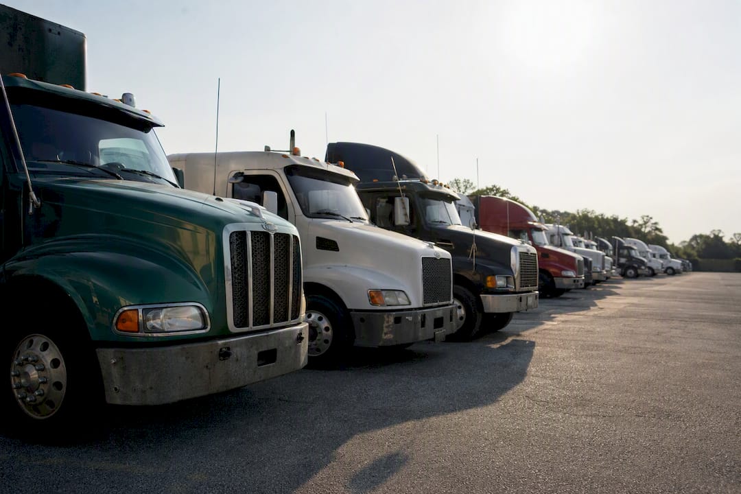 Mixed-age truck fleet parked outside