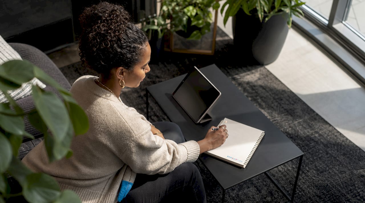 Woman reviewing event video clips on tablet