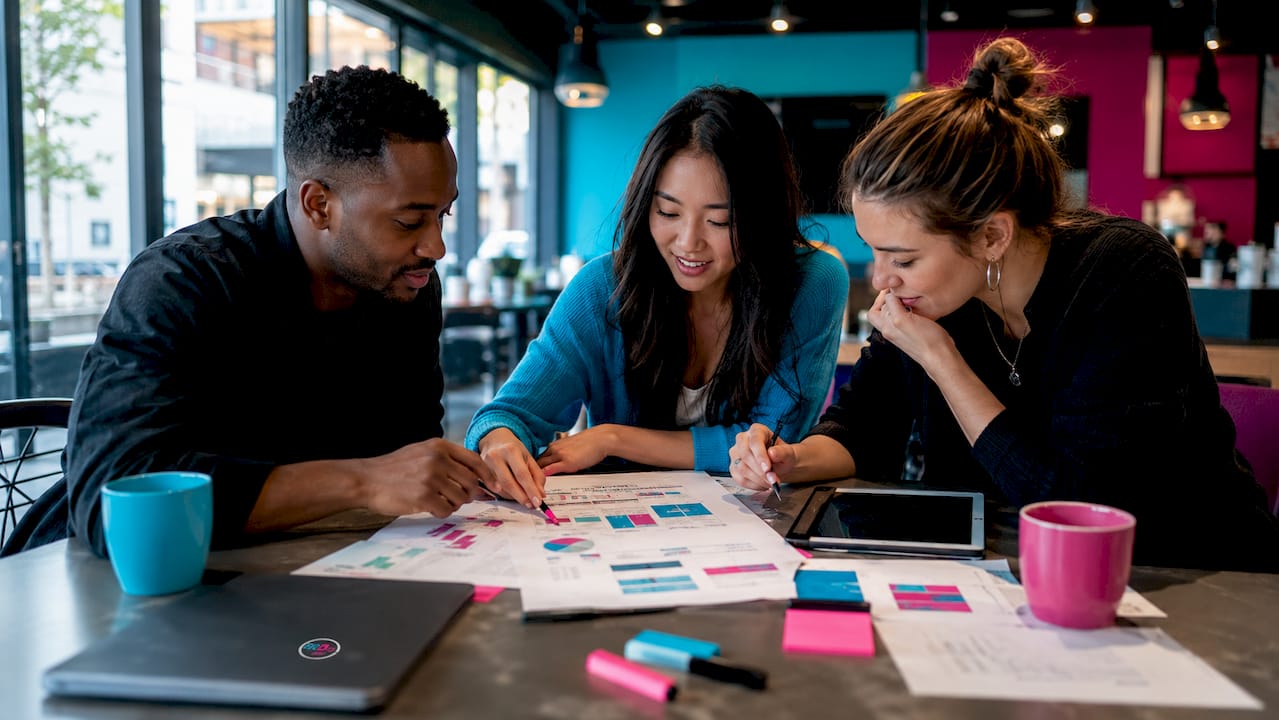 Team discussing media campaign at conference table