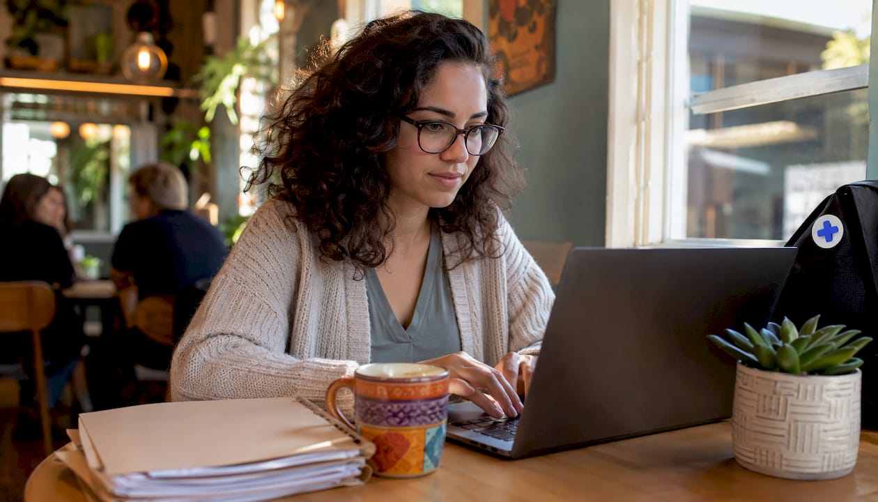 Therapist typing notes in home office
