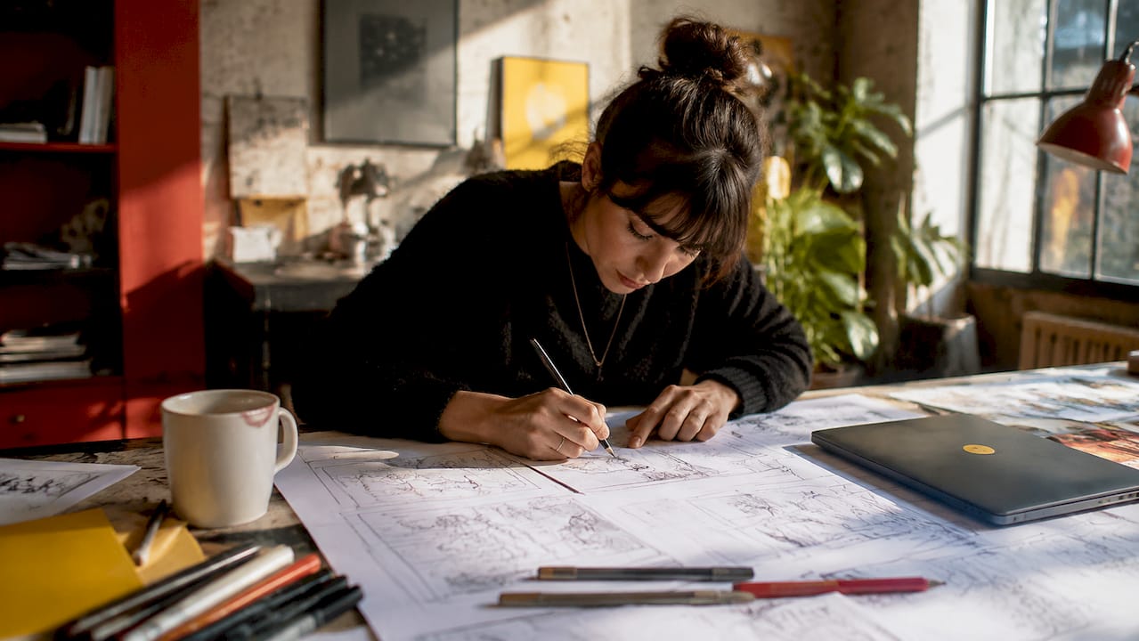 Storyboard artist sketching advertising frames