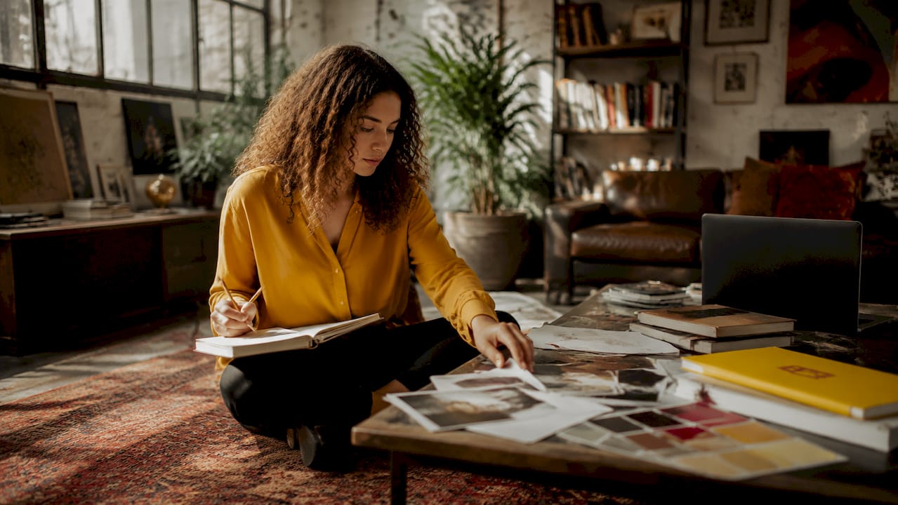 Art director reviewing visual samples at studio desk