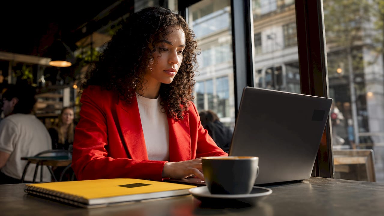 Marketing specialist editing campaign images at desk