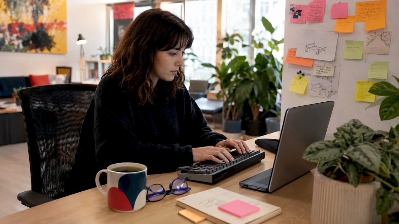 Hands typing AI marketing content optimization