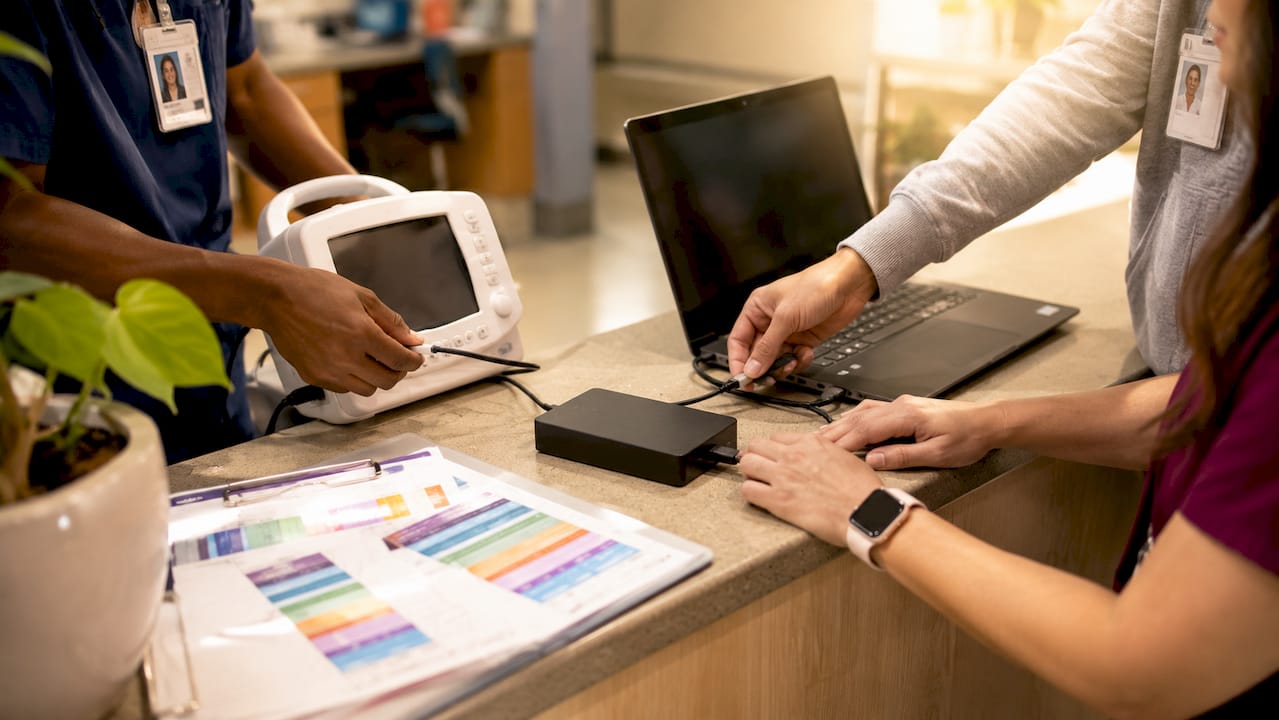 Healthcare staff connecting interoperable devices