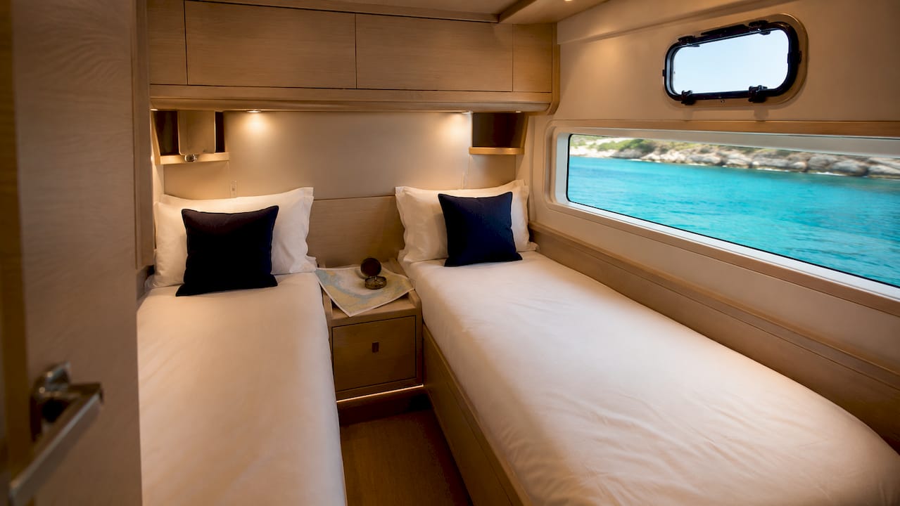 Modern 4-cabin catamaran guest cabin interior