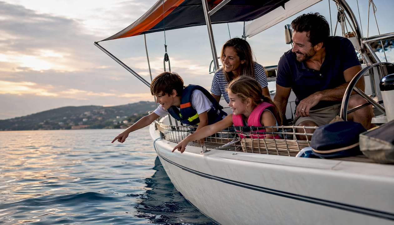 Family with children sailing safely together