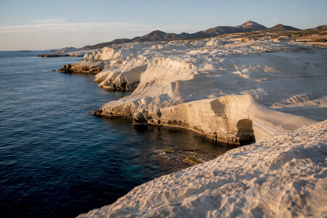 Volcanic white rocks and turquoise sea at Milos Sarakiniko