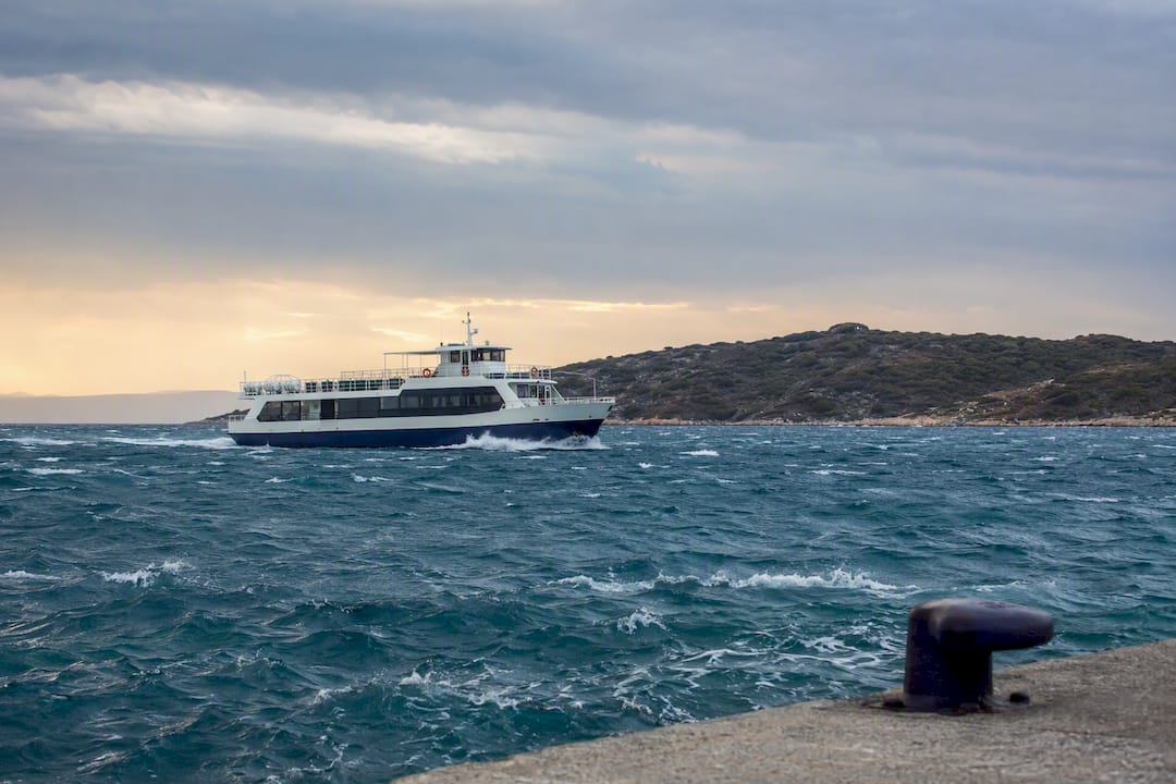 Passenger ferry crossing choppy Ionian water