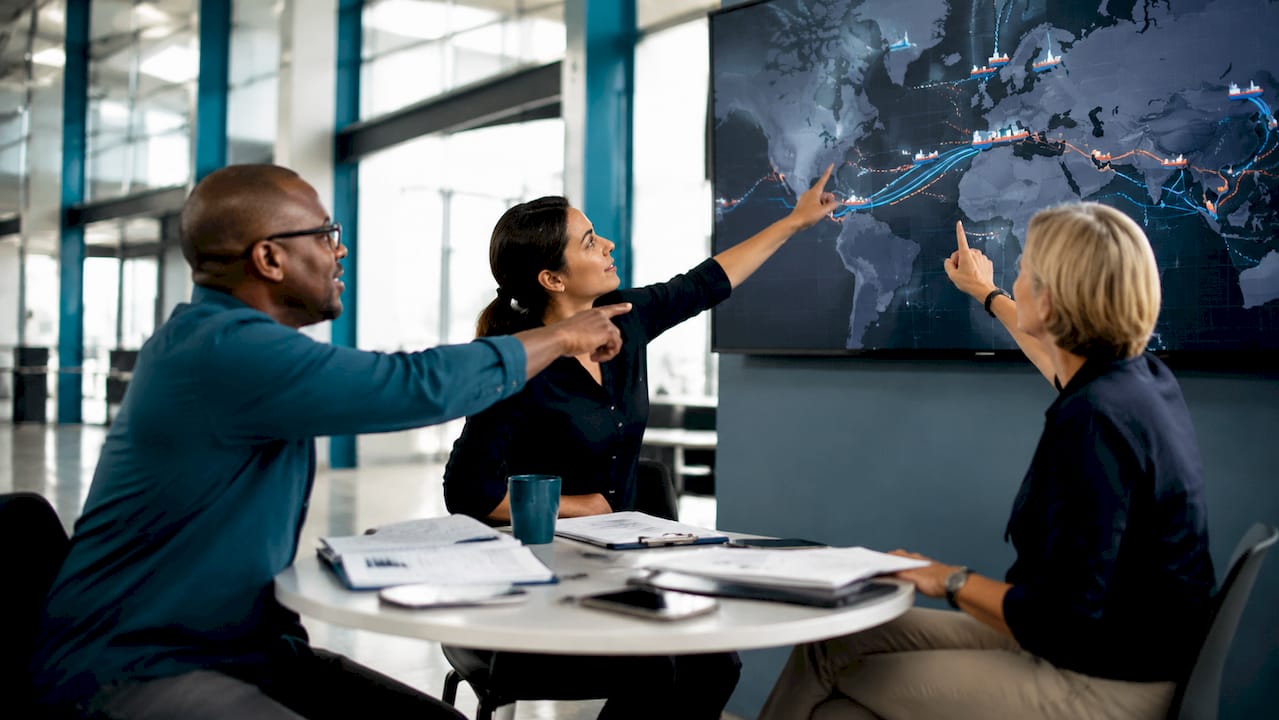 Logistics team reviewing shipment tracking together