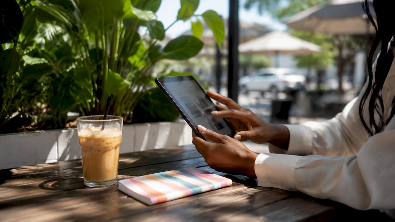 Hands browsing AI landing page templates on tablet