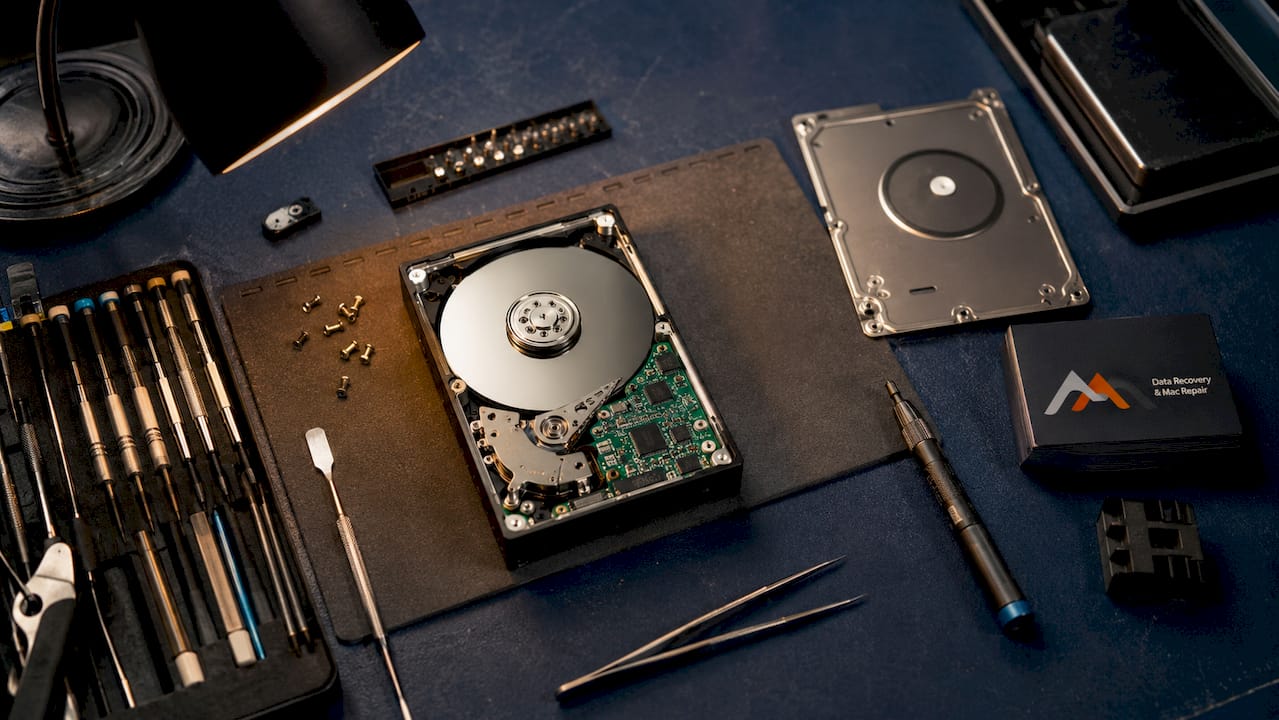 Examples of Data Backup Methods: Your 2026 Guide 3 Opened external hard drive with repair tools