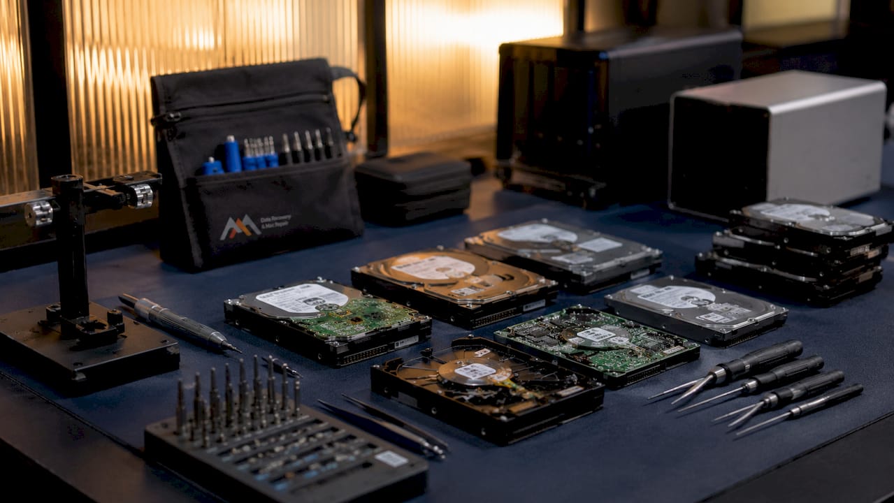 The Role of RAID in Data Backup: A Clear Guide 3 Hard drives and recovery tools in data recovery lab