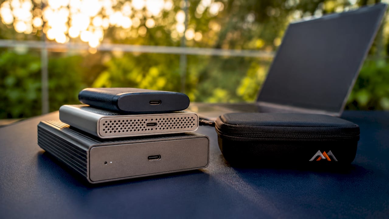 MacBook Internet Recovery: What It Is and How to Use It 3 Array of external hard drives and SSDs on white table
