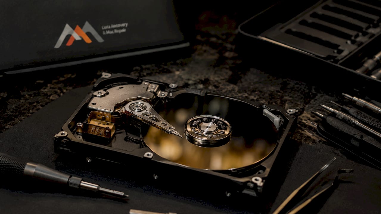 Why MacBook Pro Recovery Differs by Model and Generation 3 Opened hard drive platter for data recovery