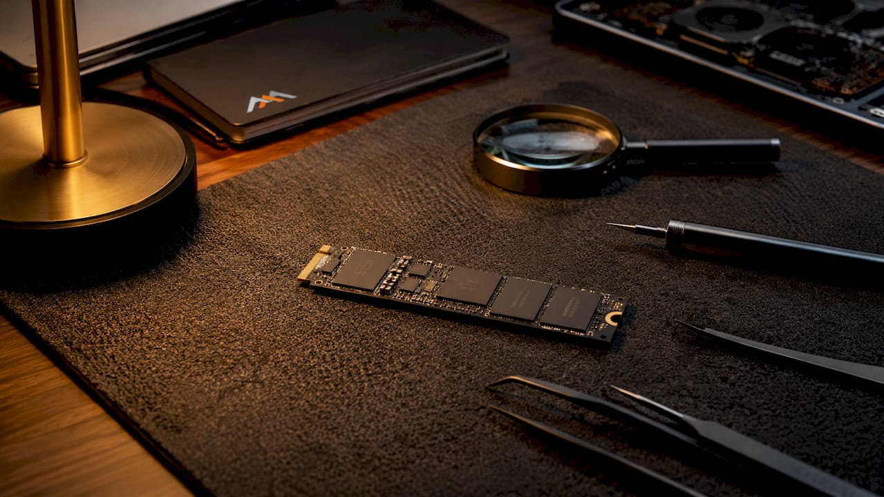 Overhead view of MacBook logic board with SSD components