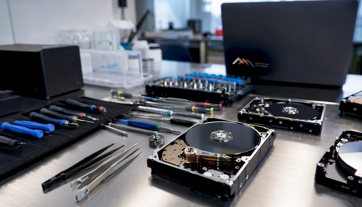 Data recovery lab workbench with tools and hard drives