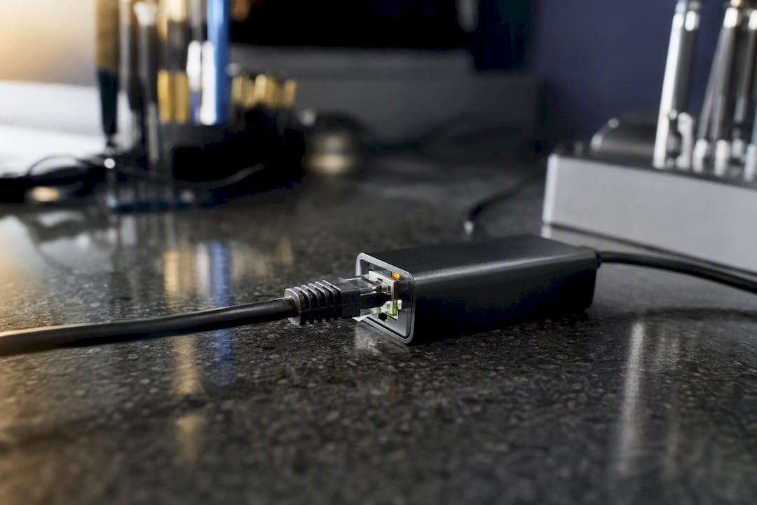 Fixing Internet Recovery Not Working on Your Mac 3 Ethernet cable and adapter on repair bench