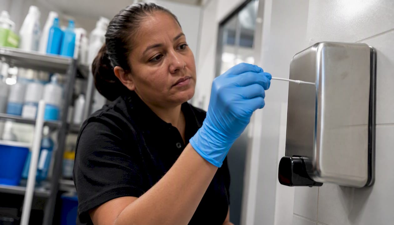 Cleaning staff performing ATP swab test