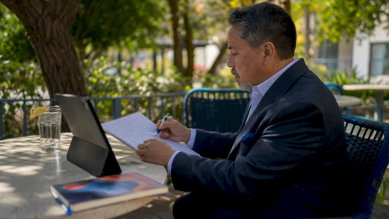 Manager reviewing cleaning service feedback at desk