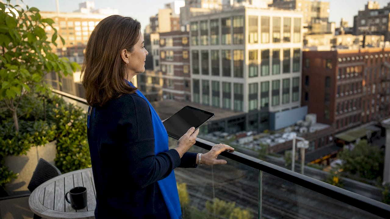 Property manager inspecting dirty office window