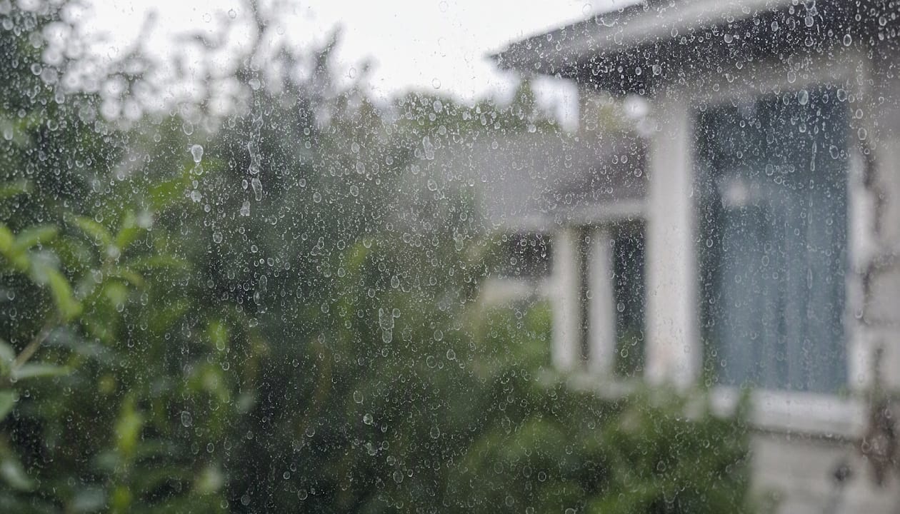 Close-up of hard water spots on window glass